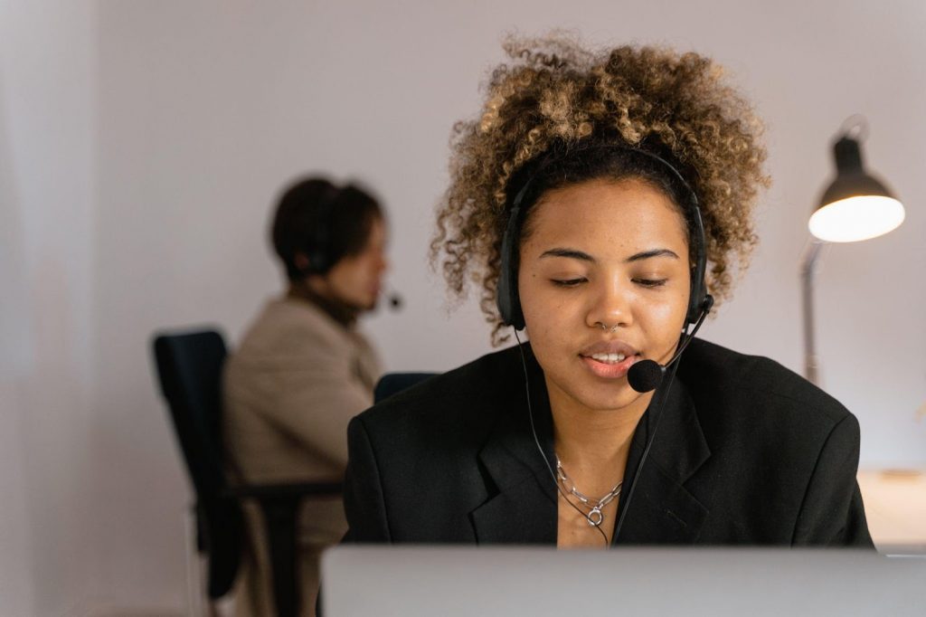 A customer service manager working in an office.